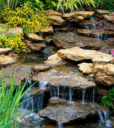 Water fall feature installed in a backyard by BP Landscaping Nampa Idaho
